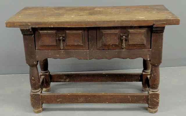 Appraisal: Jacobean style walnut table with two drawers and a stretcher