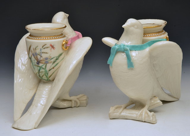 Appraisal: A PAIR OF ROYAL WORCESTER VASES each in the form