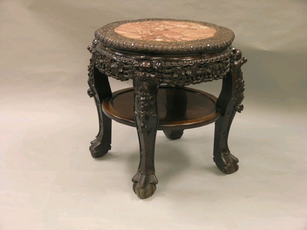 Appraisal: A late th century Chinese hardwood jardiniere stand circular shape