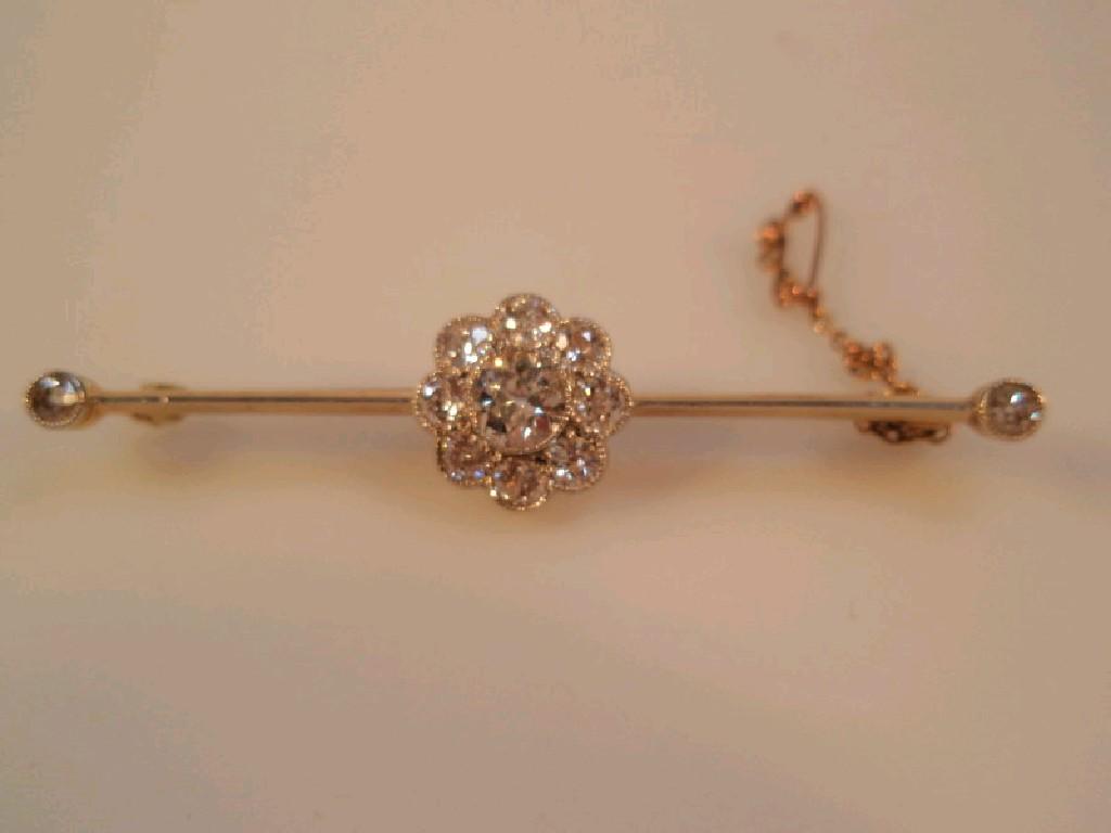 Appraisal: A diamond set floral motif bar brooch the centrally set