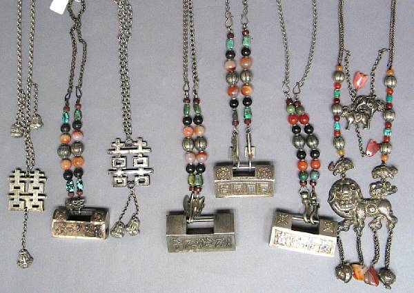 Appraisal: A group of seven Mandarin silvered metal necklaces and lockets