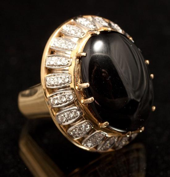 Appraisal: Lady's K yellow gold diamond and opaque black gemstone cabochon