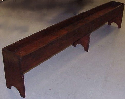 Appraisal: Long wooden planter rounded boot jack ends and center support