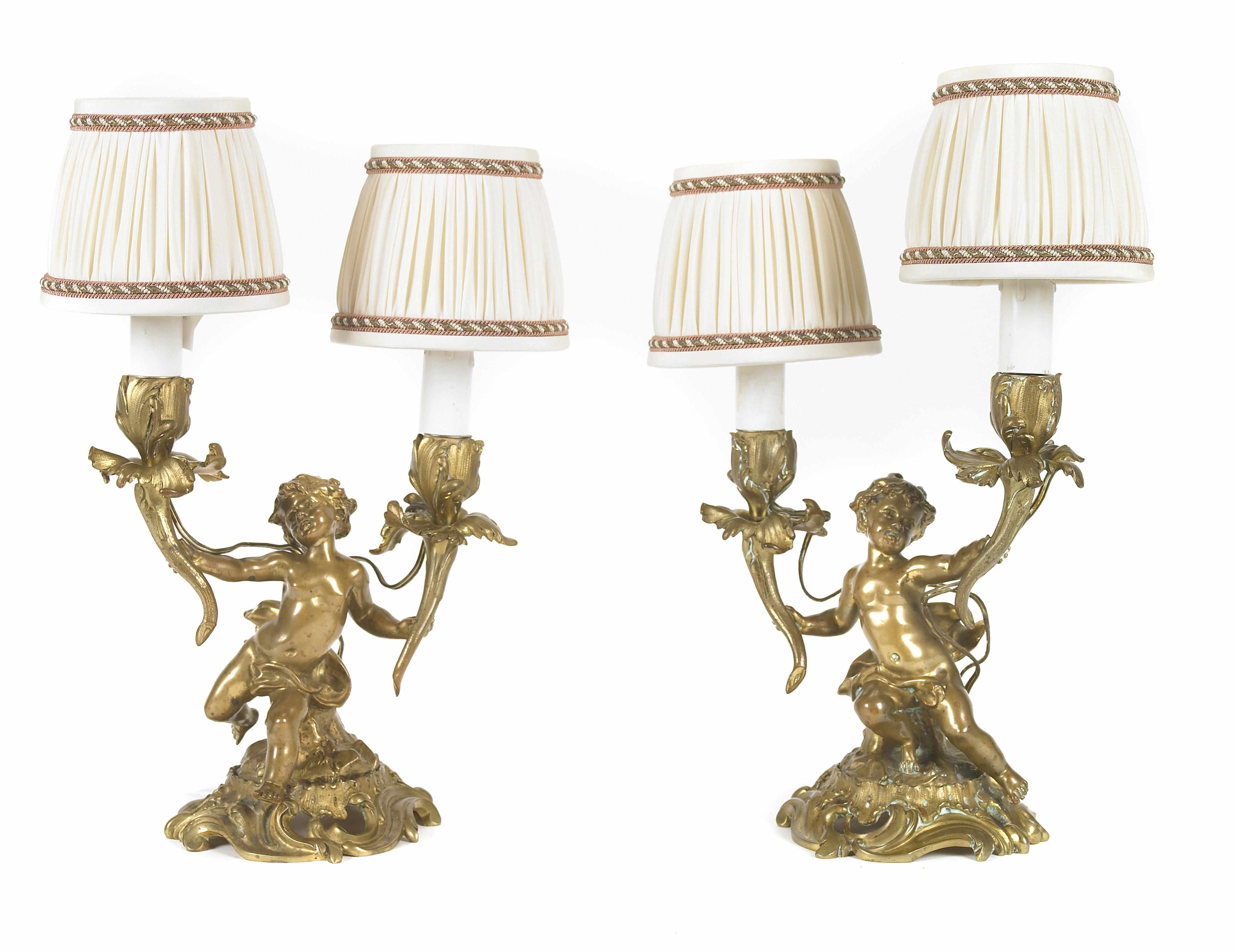 Appraisal: A pair of Louis XV style gilt bronze two light