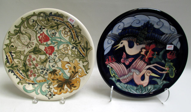 Appraisal: TWO MOORCROFT POTTERY CHARGERS with hand painted under glaze the