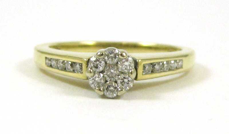 Appraisal: DIAMOND AND TEN KARAT GOLD RING set with round-cut diamonds