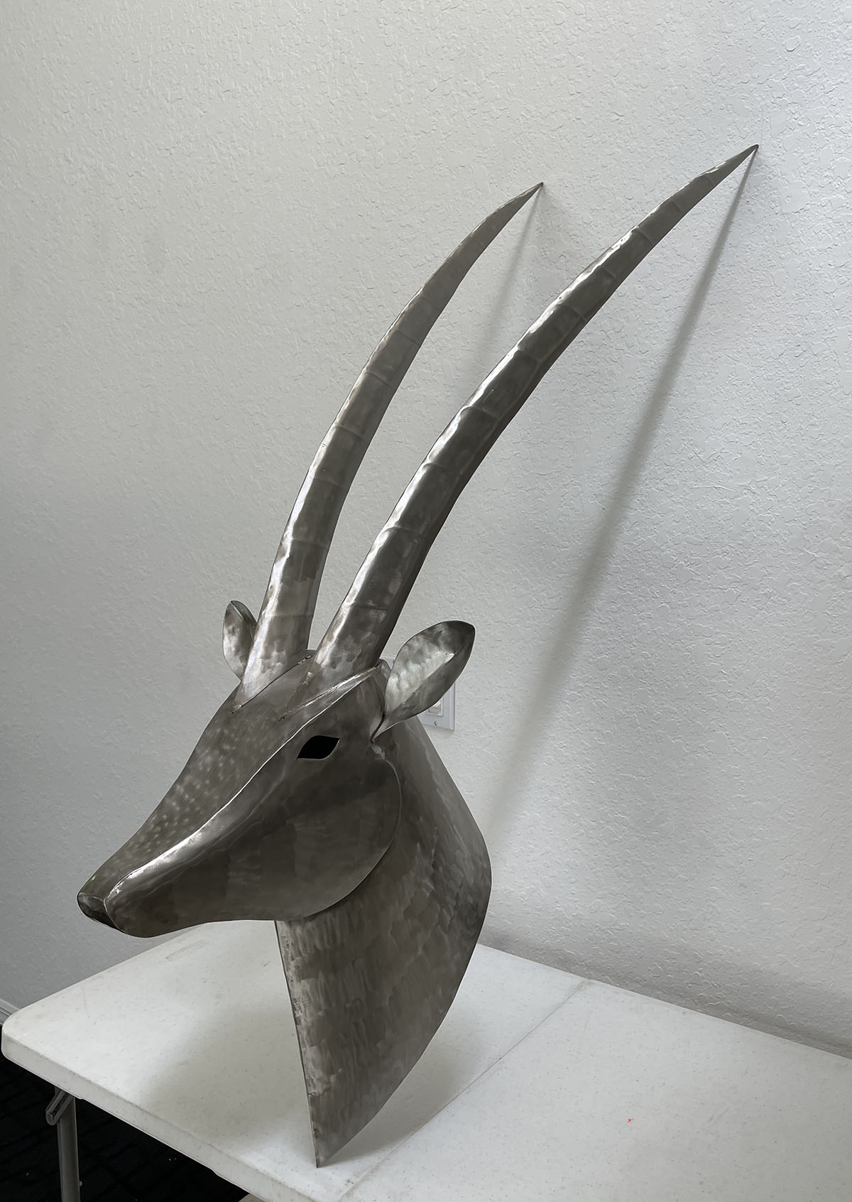 Appraisal: STUART PETERMAN STAINLESS STEEL ANTELOPE MOUNT ''h x ''l x