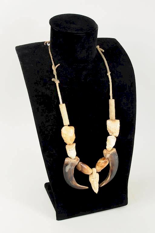 Appraisal: Inuit Carved Walrus Ivory Bear Claw Necklace Inuit carved walrus