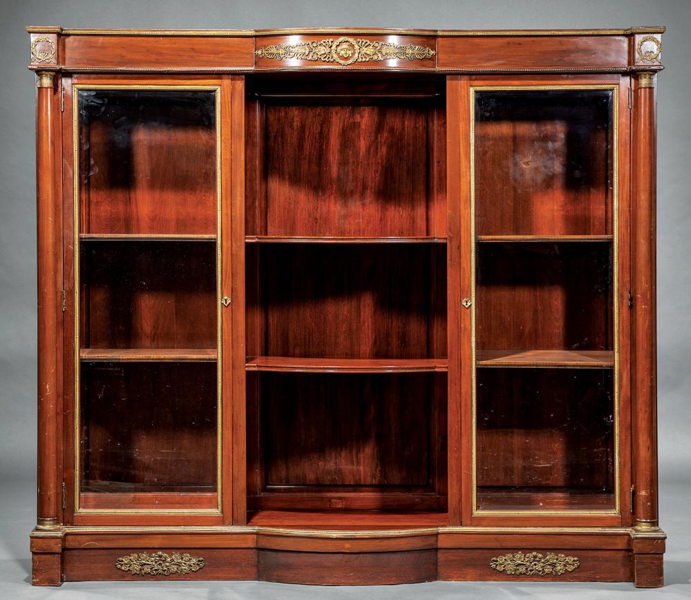 Appraisal: Empire-Style Bronze-Mounted Mahogany Bibliotheque th c shaped top conforming shelves