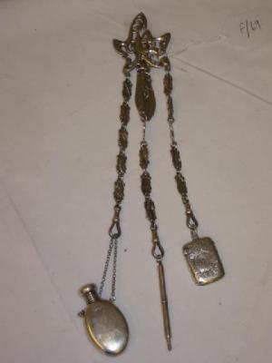 Appraisal: AN ART NOUVEAU CHATELAINE the pierced stylised top hanging with