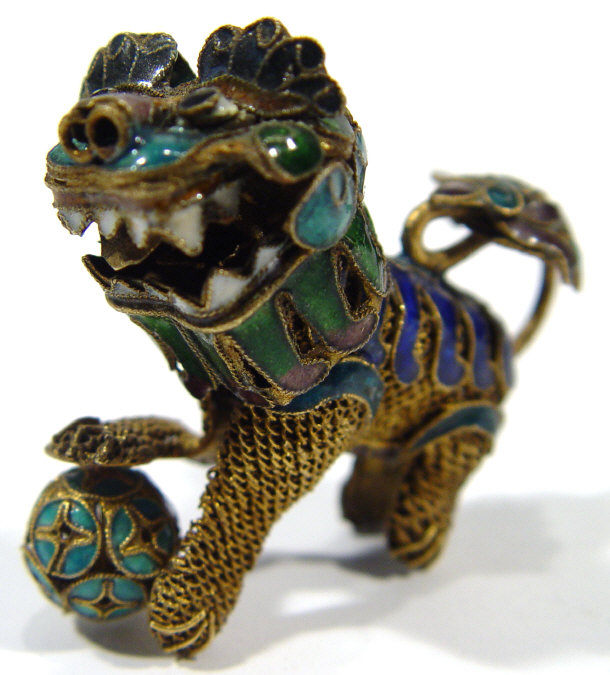 Appraisal: Oriental gilt metal and cloisonne dog of Foo with revolving