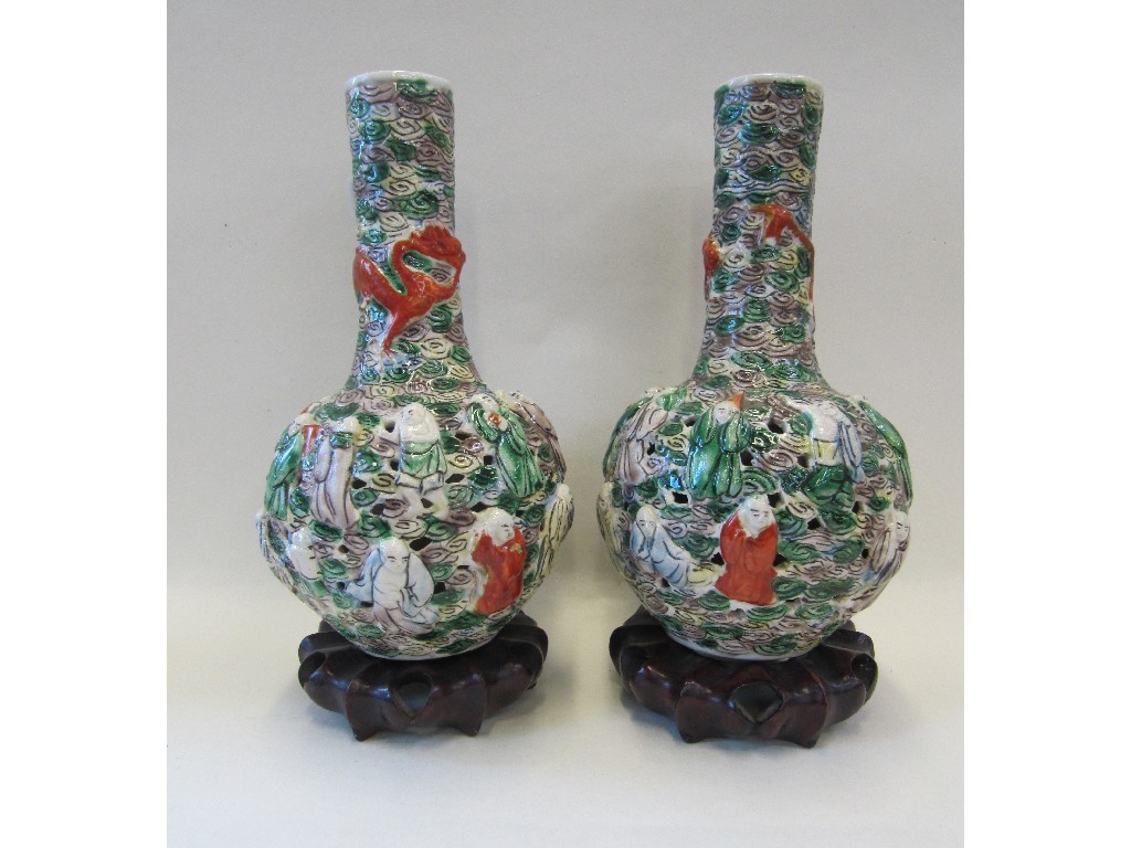 Appraisal: Pair of Chinese reticulated vases decorated with figures