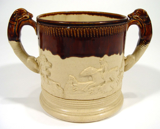 Appraisal: th Century salt glazed stoneware loving cup with greyhound handles