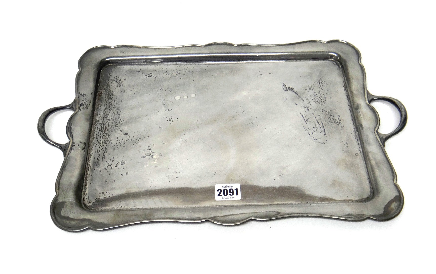 Appraisal: A silver shaped rectangular twin handled tray Sheffield length including