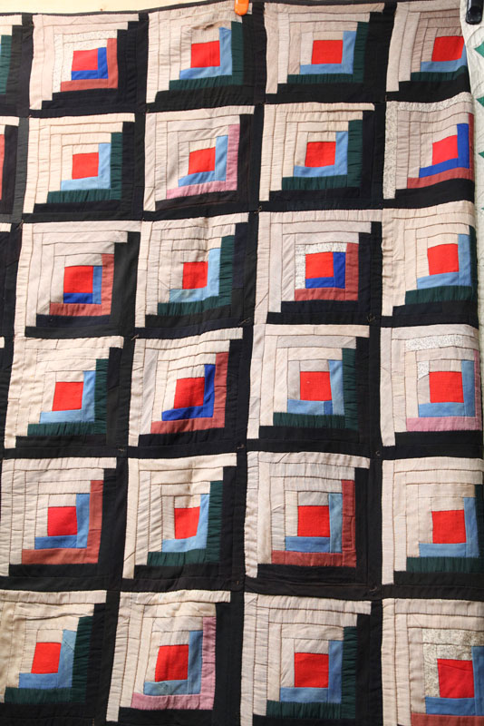 Appraisal: LOG CABIN QUILT Sunshine and Shadows pattern on a brown