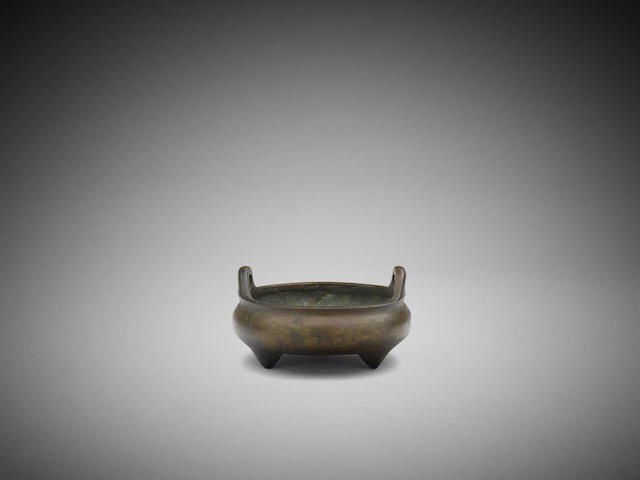 Appraisal: A Chinese bronze tripod censer Embossed Zhengde four-character mark cm