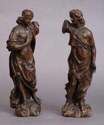 Appraisal: PAIR OF BAROQUE-STYLE CARVED WALNUT FIGURES OF ANGELS Each lacking