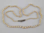 Appraisal: A graduated cultured pearl necklace approx cm long pearls between