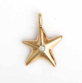 Appraisal: An ct gold diamond set star charm by Tiffany Co