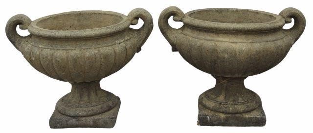 Appraisal: pair Cast stone garden statuary urn-form planters with dual handles