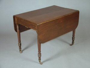 Appraisal: A mahogany stained drop leaf extending dining table th century