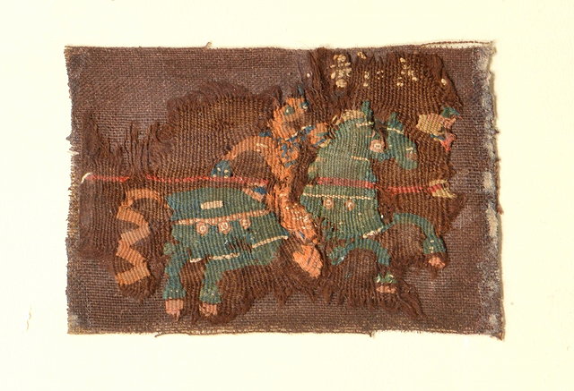 Appraisal: A RECTANGULAR FRAGMENT portraying a warrior on horseback holding a