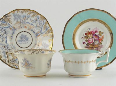 Appraisal: Two Rockingham teacups and saucers and a Rockingham trio with