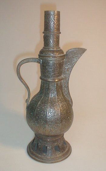 Appraisal: A middle Eastern ornate tin and copper ewer