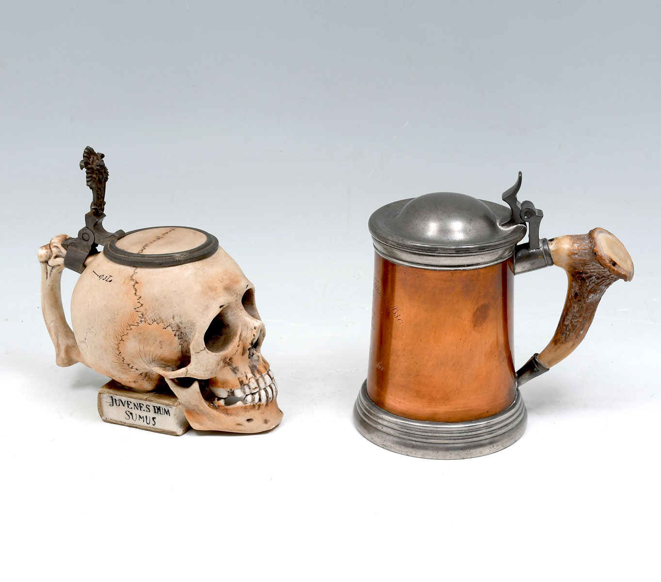 Appraisal: PC COPPER PORCELAIN SKULL TANKARDS - Porcelain pewter skull form