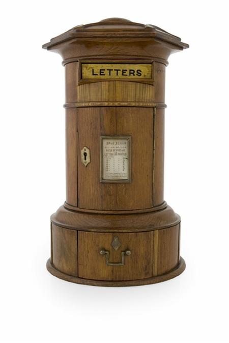 Appraisal: A Victorian oak country house letter box of cylindrical form