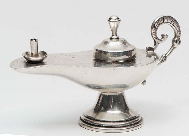 Appraisal: A CHILEAN SILVER TABLE CIGAR LIGHTER in the form of