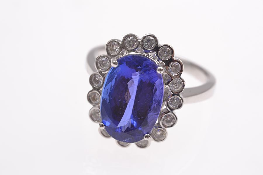 Appraisal: A TANZANITE AND DIAMOND CLUSTER RING THE TANZANITE WEIGHING CTS