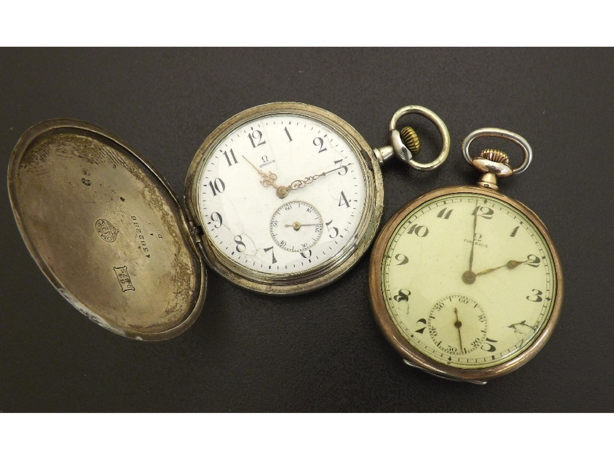 Appraisal: Omega white metal engine turned hunter lever pocket watch together