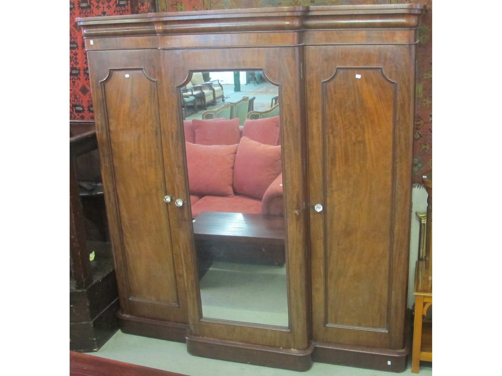 Appraisal: A Victorian mahogany three door breakfront mirrored wardrobe