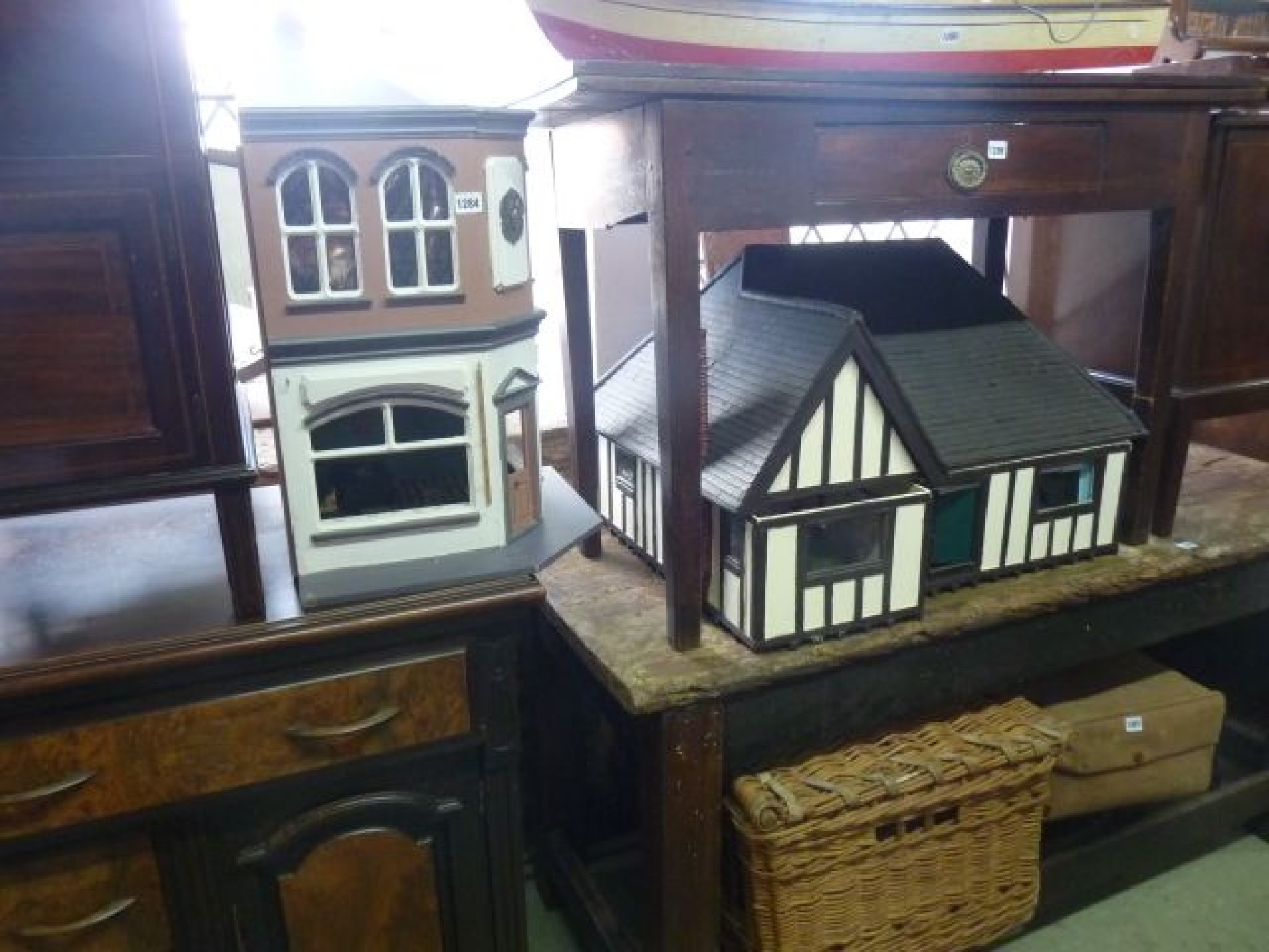 Appraisal: A black and white timber dolls house in the form