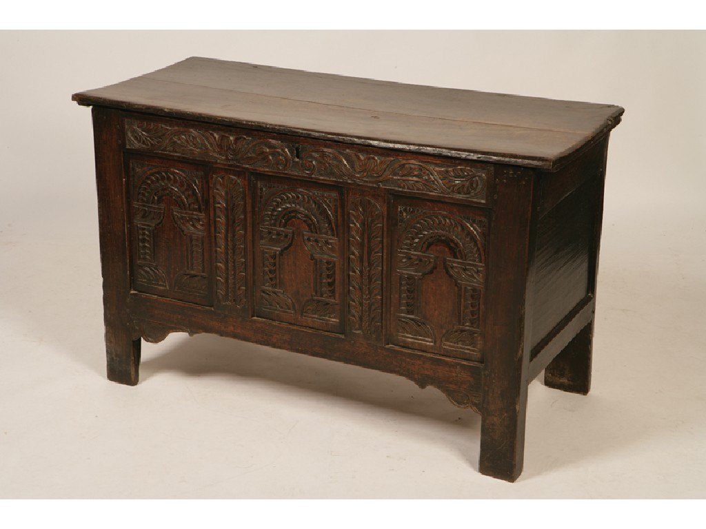 Appraisal: A CHARLES II OAK COFFER the hinged top above a