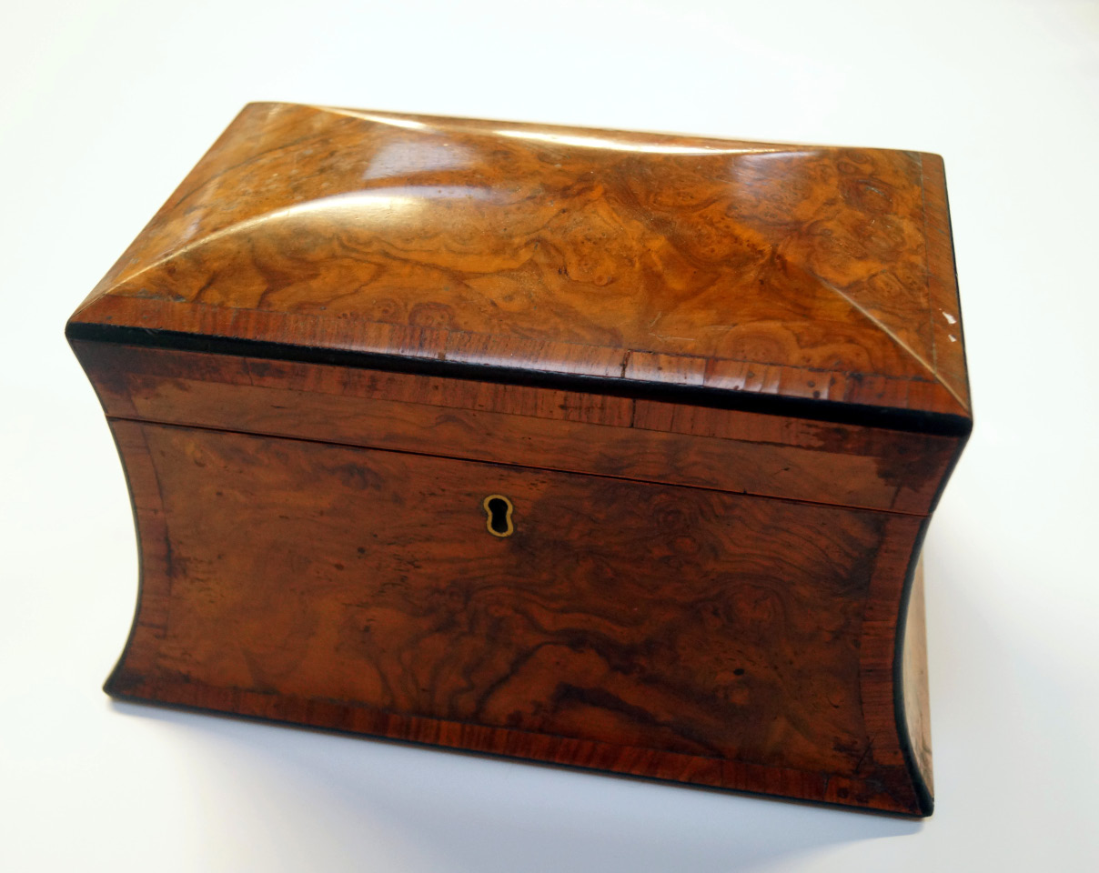 Appraisal: A thC walnut tea caddy of shaped rectangular outline the