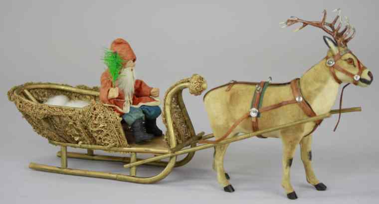 Appraisal: SANTA IN SLEIGH PULLED BY REINDEER CANDY CONTAINER Germany early