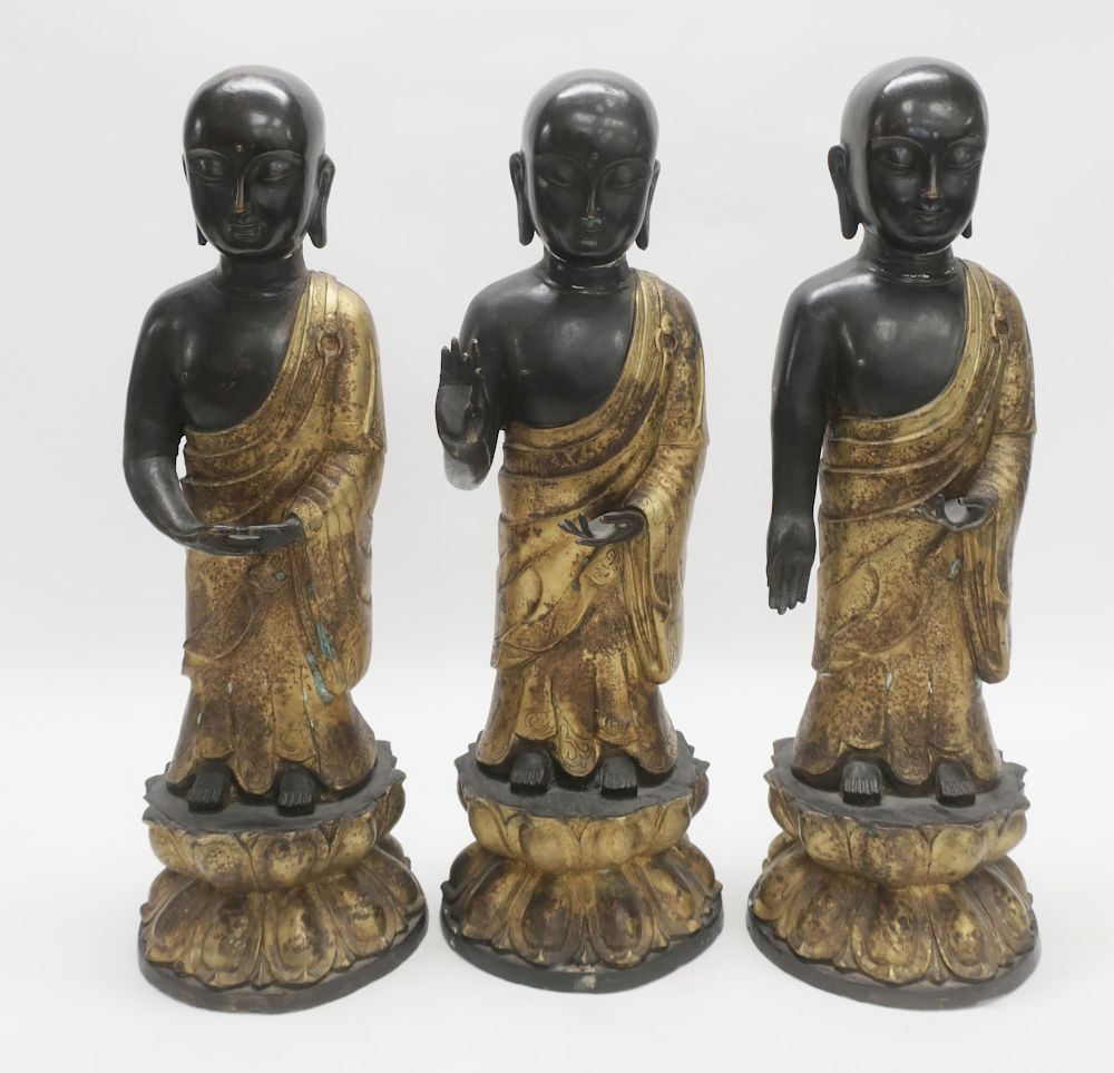 Appraisal: Asian Bronze Parcel Gilt Standing Figures on lotus bases H