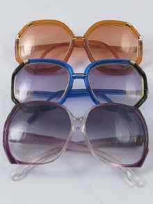 Appraisal: Three pairs of fashion sunglasses one Yves St Laurent two