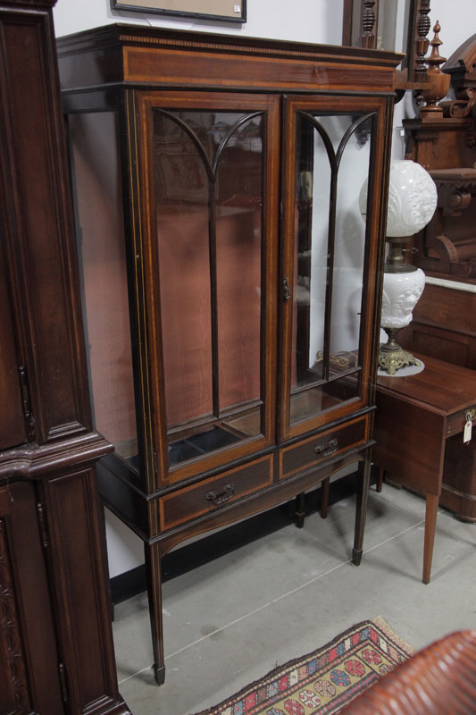 Appraisal: CHINA CABINET Veneered cabinet having a stepped cornice glazed doors