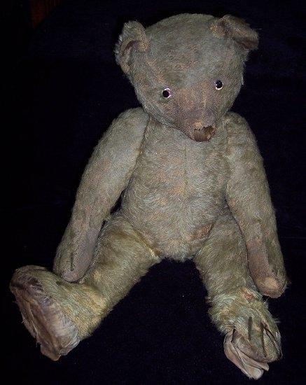 Appraisal: A teddy bear with swivel joints and beaded eyes circa