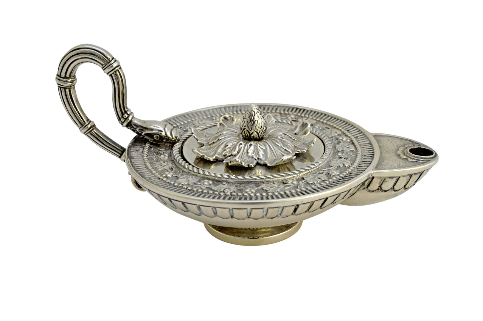 Appraisal: A silver table lighter modelled as a classical style oil