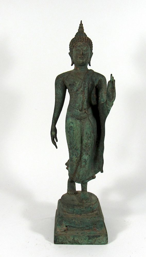 Appraisal: Southeast Asian Bronze Figure of Walking Buddha Dressed in simple