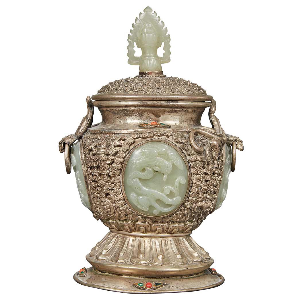 Appraisal: Mongolian Silvered Metal Covered Vessel Inlaid with Jade Panels Height