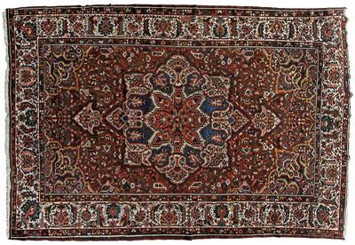 Appraisal: Baktiari rug large star-shaped central medallion on burgundy brown field