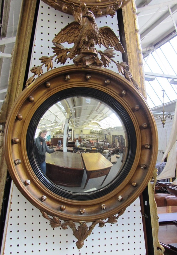 Appraisal: A pair of Regency design gilt framed circular wall mirrors