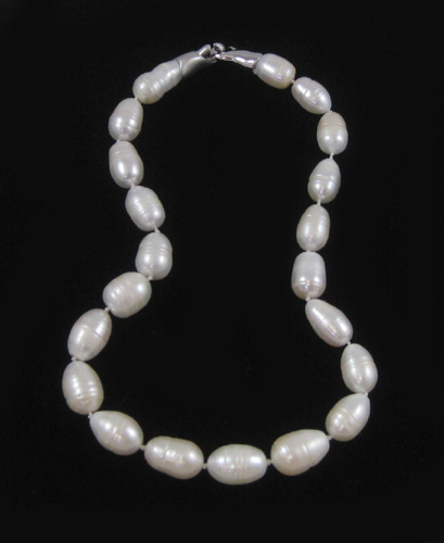 Appraisal: PRINCESS LENGTH BAROQUE WHITE PEARL NECKLACE strung with baroque white