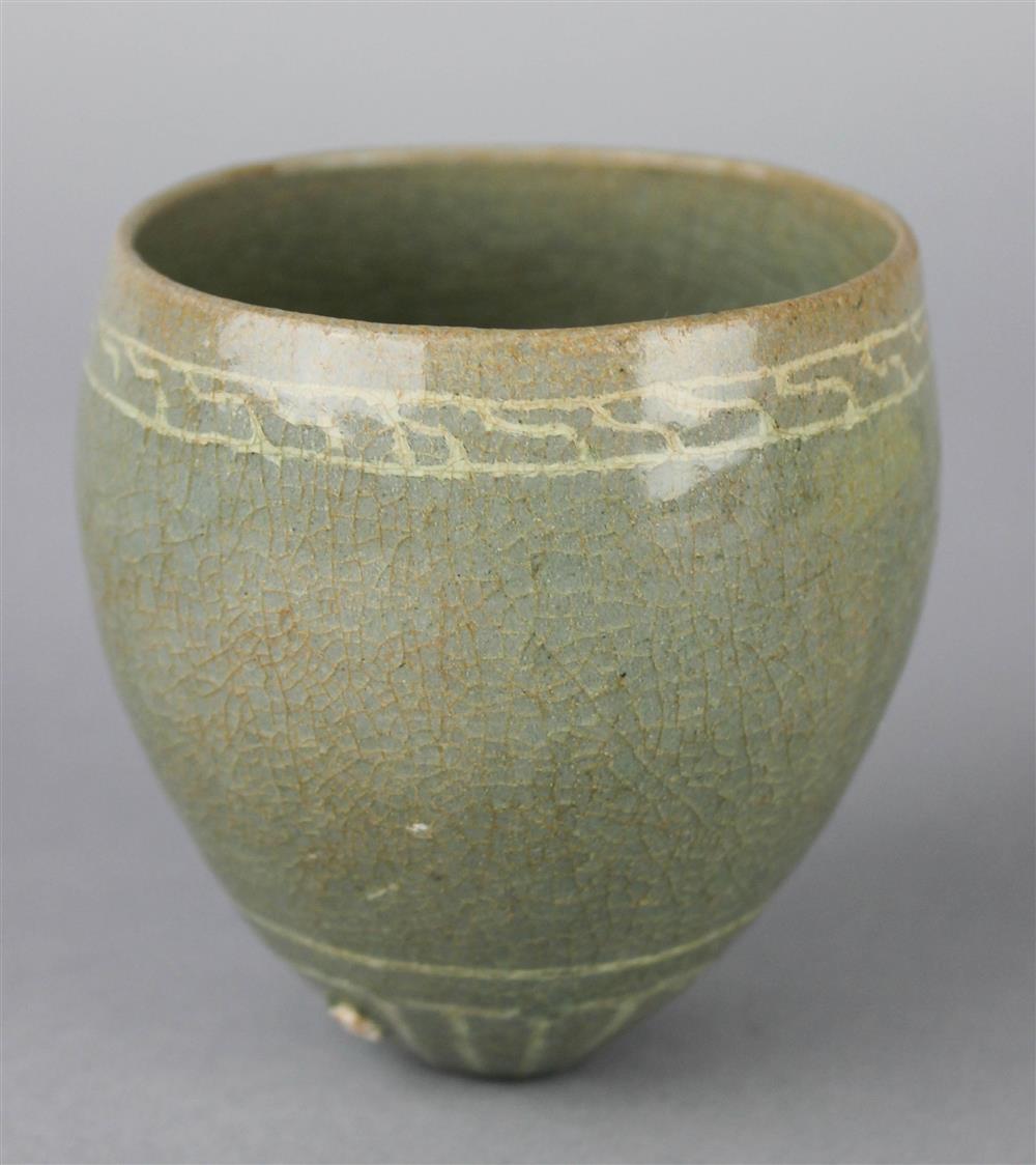 Appraisal: TWO SLIP-DECORATED CELADON PIECES including a conical cup with a