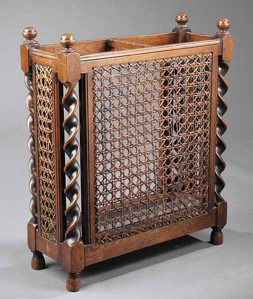 Appraisal: An Edwardian Oak and Caned Umbrella Stand the rectangular frame